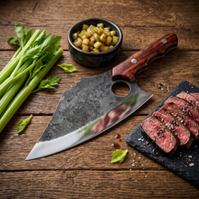 Mastodon 7.5 inch hand forged cleaver knife on a cutting board, lifestyle view