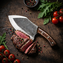 Kodiak high carbon steel cleaver with polished edge and rosewood handle, angled view