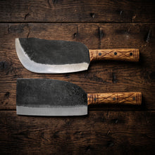 Grizzly hand forged butcher cleaver shown in a group of cleavers for boning